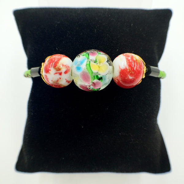 Triple Flower Clear and Ceramic Beads on Green Leather
